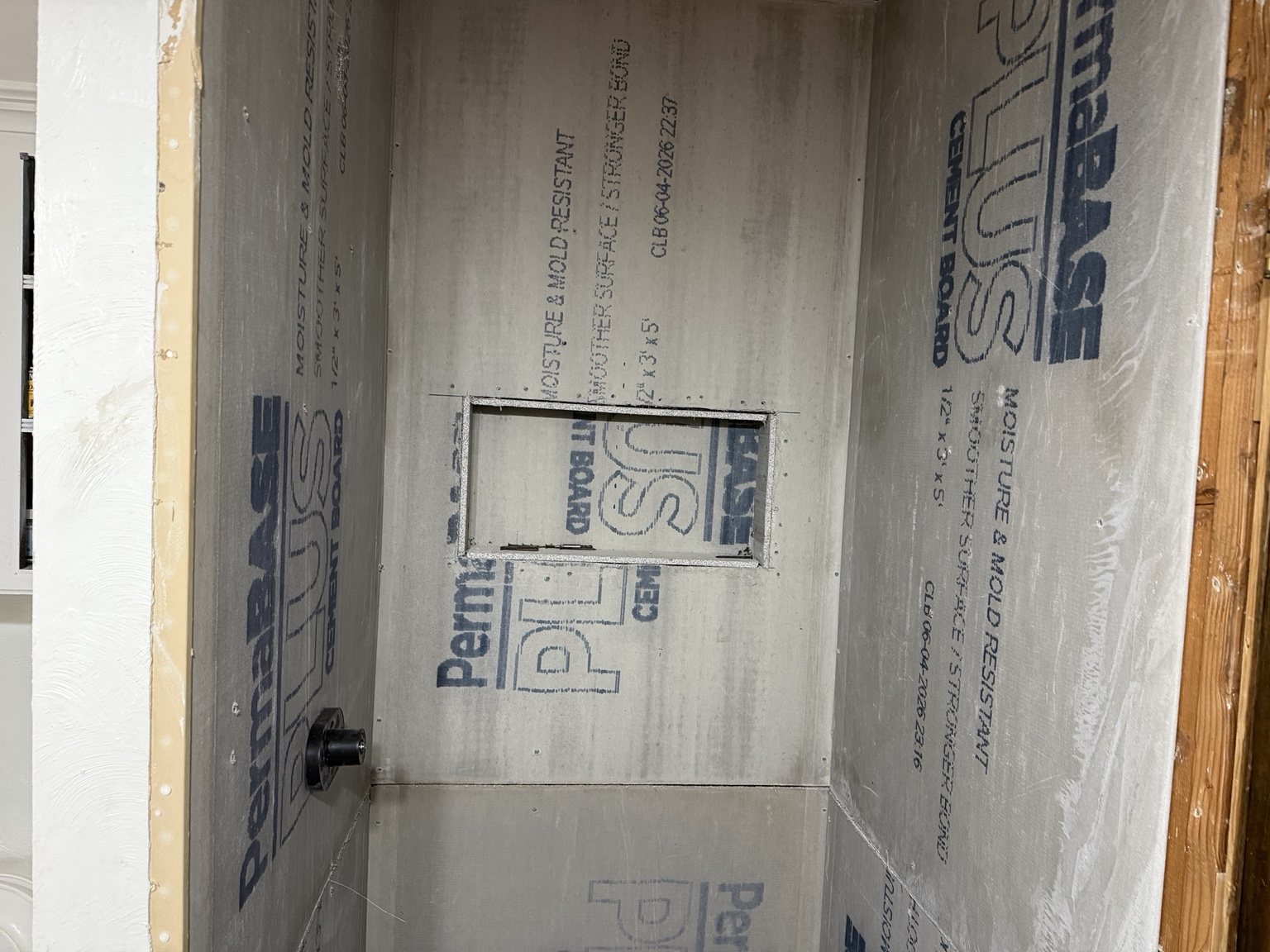 Cement board and recessed shower niche construction